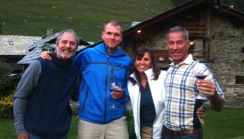 Guide and clients enjoying drinks on the tour of Monte Rosa
